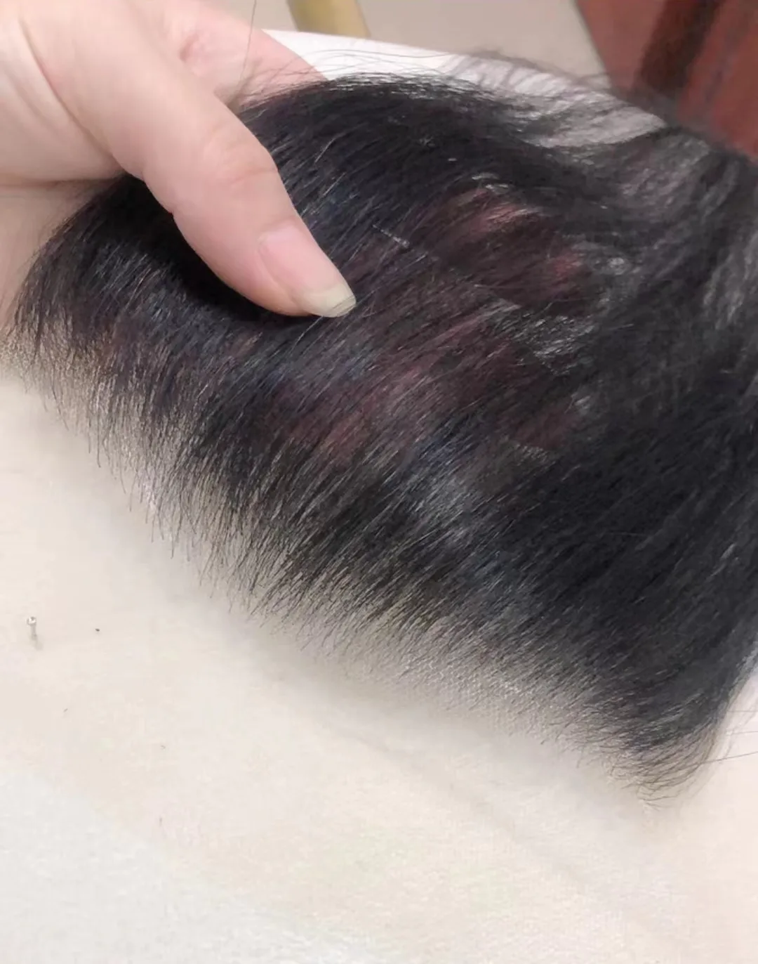Bespoke luxury human hair wigs worn by celebrities, custom styled and color-matched for crown chakra restoration.